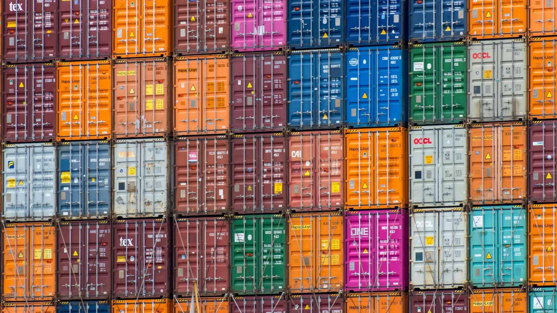 a large stack of shipping containers