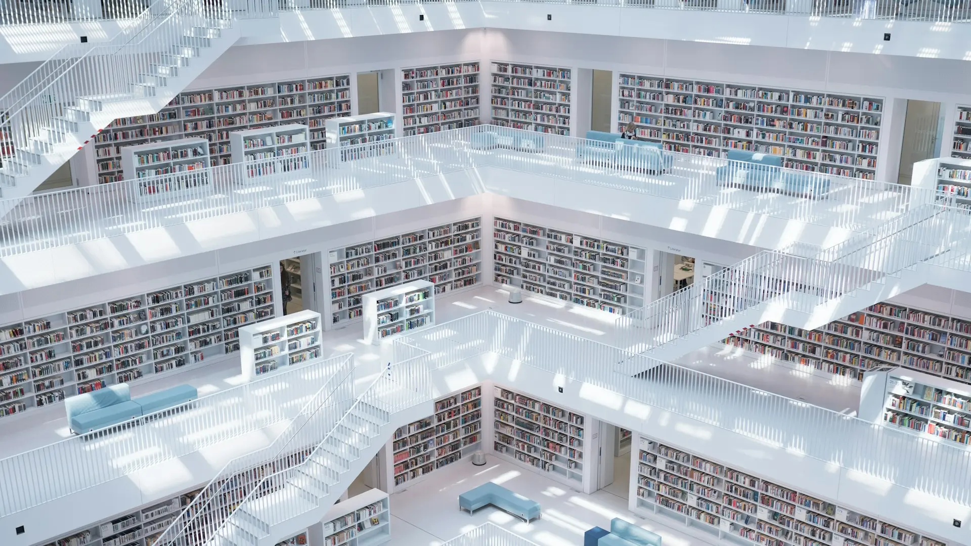 high rise view looking up through a library's bookshelves